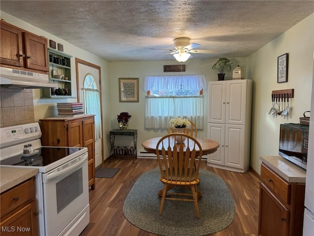 kitchen with a textured ceiling, tasteful backsplash, white range with electric cooktop, and dark wood-type flooring