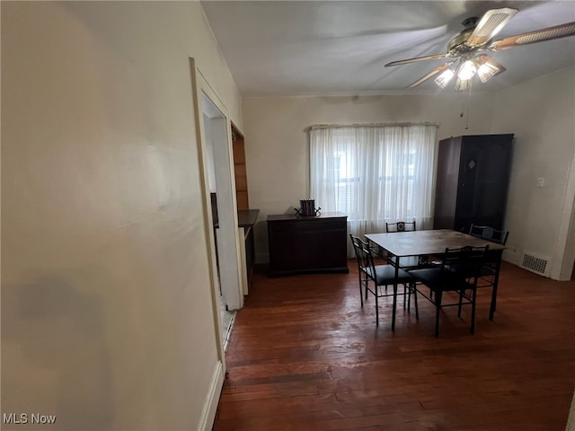 dining space featuring dark hardwood / wood-style floors and ceiling fan