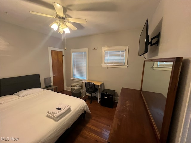 bedroom featuring ceiling fan and dark hardwood / wood-style floors