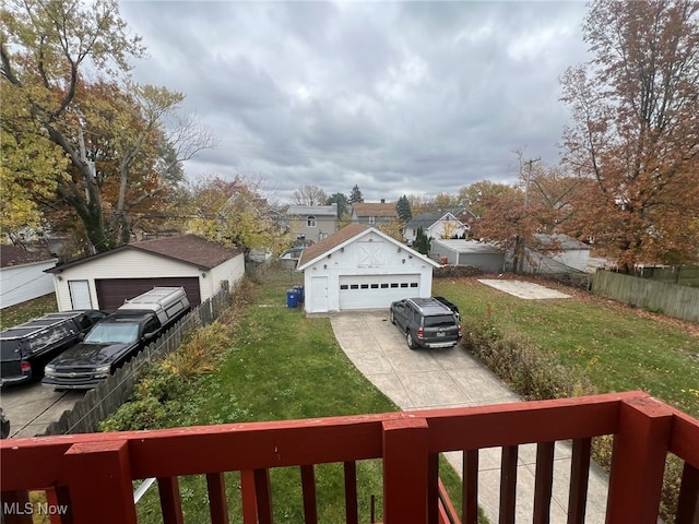 view of yard with a garage and an outdoor structure