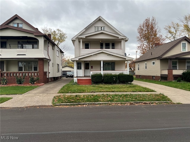 view of front facade with a porch and a front lawn