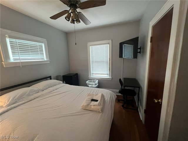 bedroom with hardwood / wood-style flooring and ceiling fan