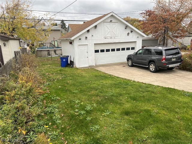 view of front of home with a garage and a front yard