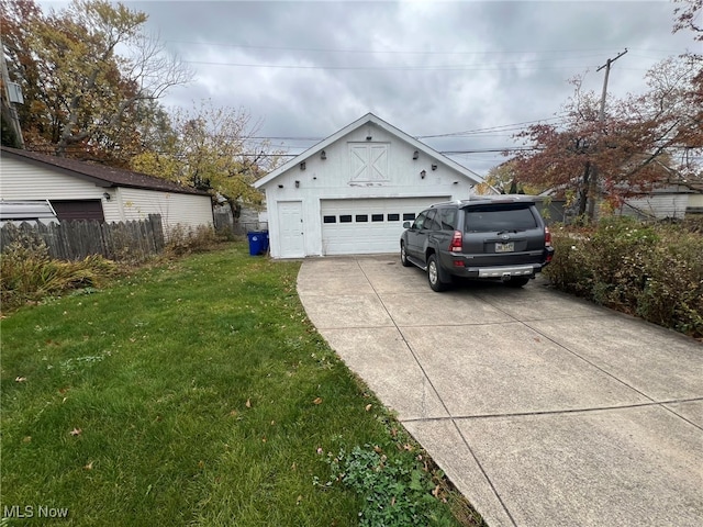 view of front of home featuring a garage and a front lawn