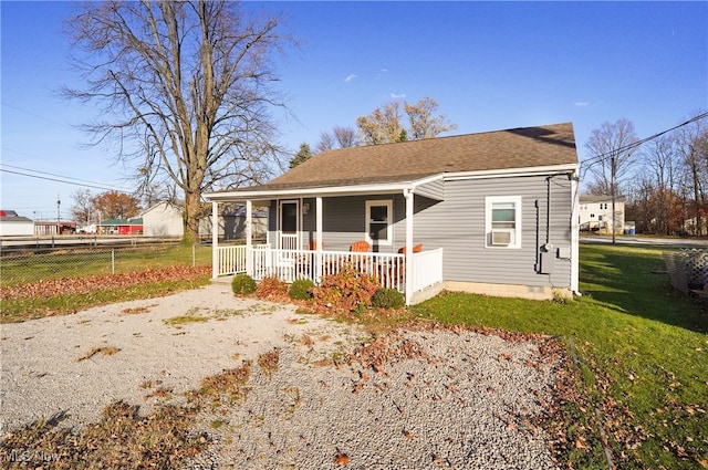 view of front of house featuring a front yard and a porch