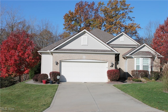 view of front of house with a front lawn and a garage