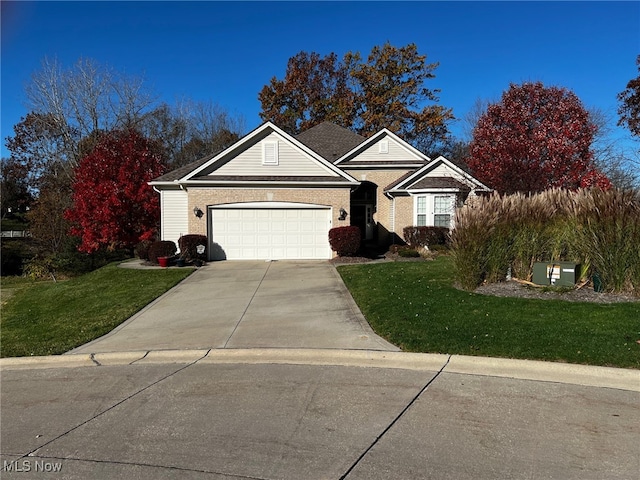 view of front of house with a garage and a front yard