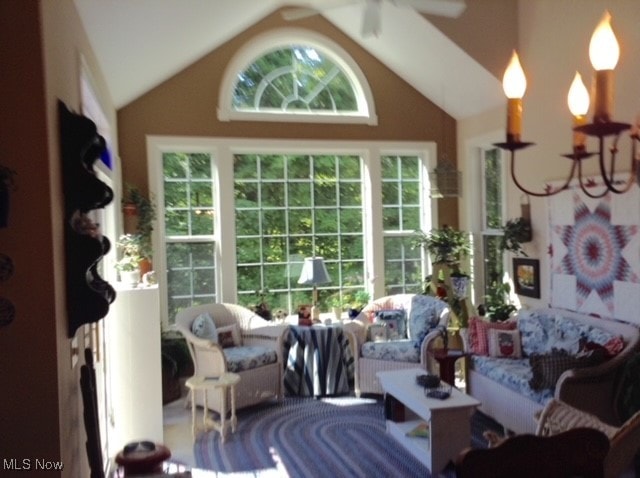 sunroom / solarium with vaulted ceiling and ceiling fan