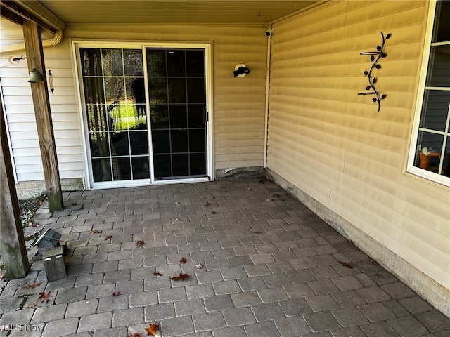 property entrance featuring a patio area