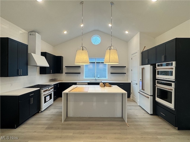 kitchen with light hardwood / wood-style floors, lofted ceiling, high quality appliances, ventilation hood, and pendant lighting