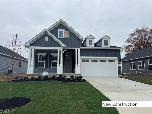 view of front facade with a garage and a front lawn