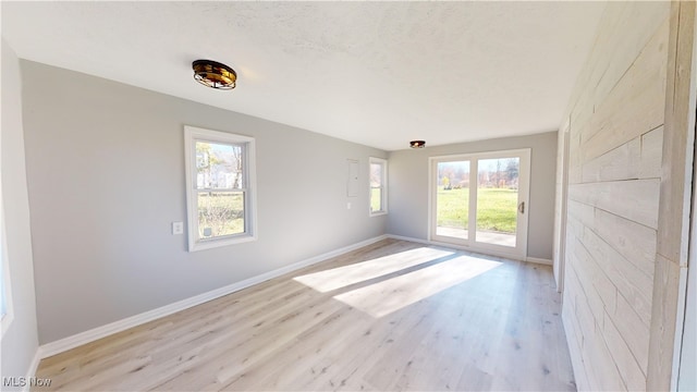 spare room featuring light hardwood / wood-style floors