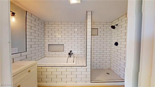 bathroom with independent shower and bath and vanity