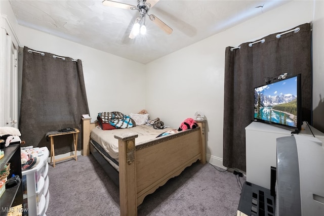 bedroom with light carpet and ceiling fan