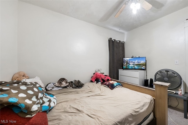 bedroom with ceiling fan and carpet flooring