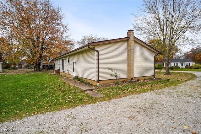 view of property exterior featuring a yard