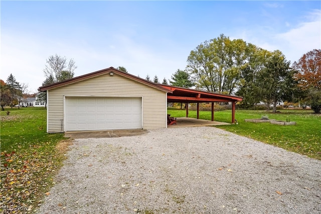 garage with a lawn and a carport