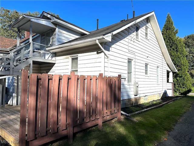 view of side of property with a deck