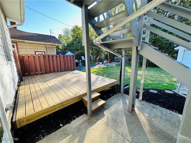 deck with a yard and a patio area