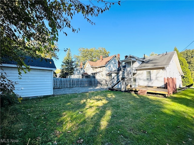 view of yard featuring a wooden deck