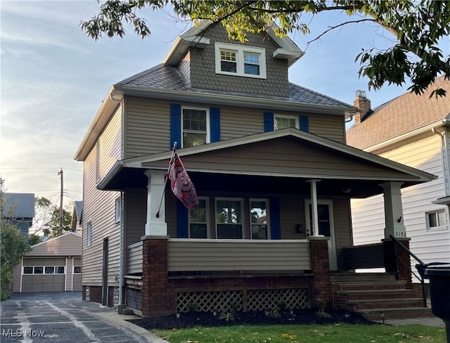 view of front of house with an outbuilding and a garage