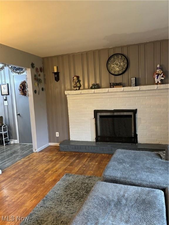 57365 Washington Blvd, Martins Ferry, OH 43935 - living area with wood finished floors and a brick fireplace