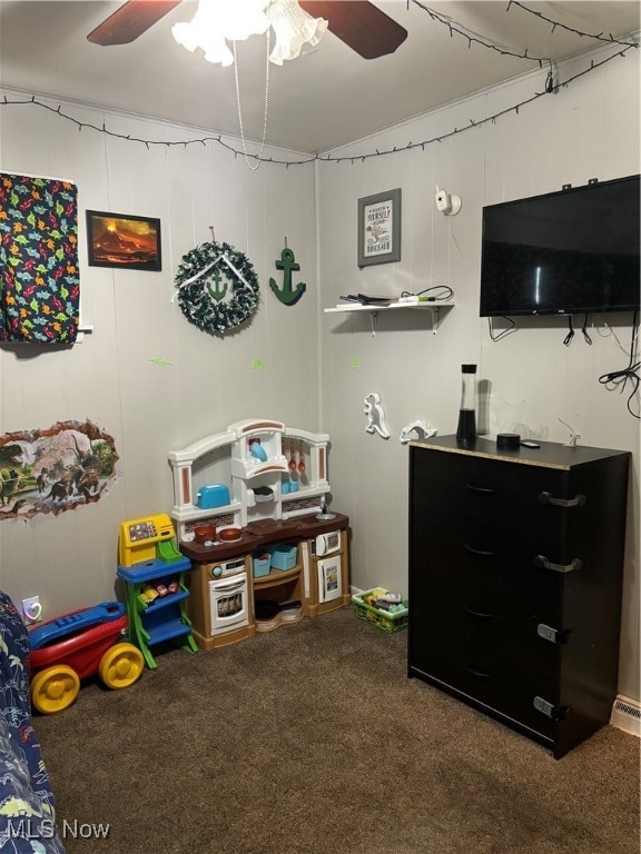 playroom with ceiling fan and carpet floors