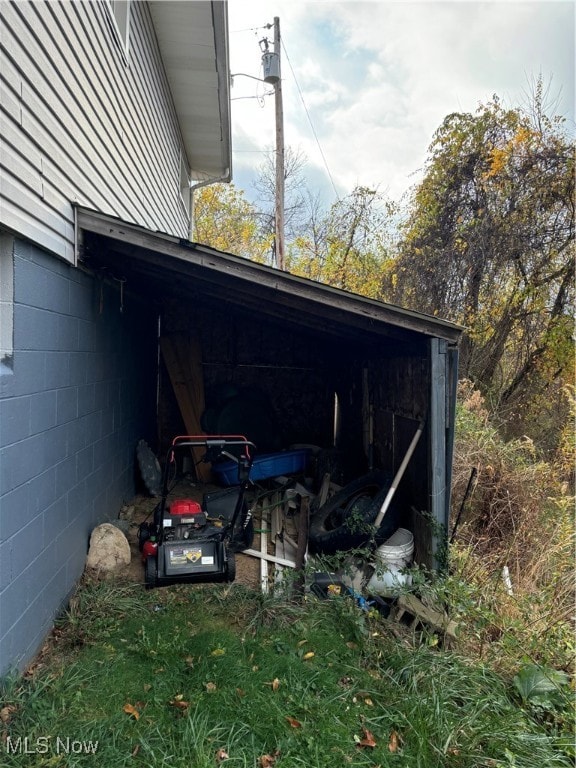 exterior space with a carport