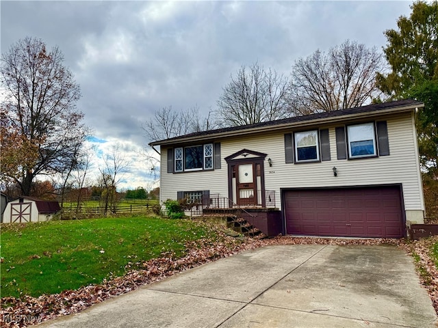 split foyer home with a garage, a front yard, and a storage unit