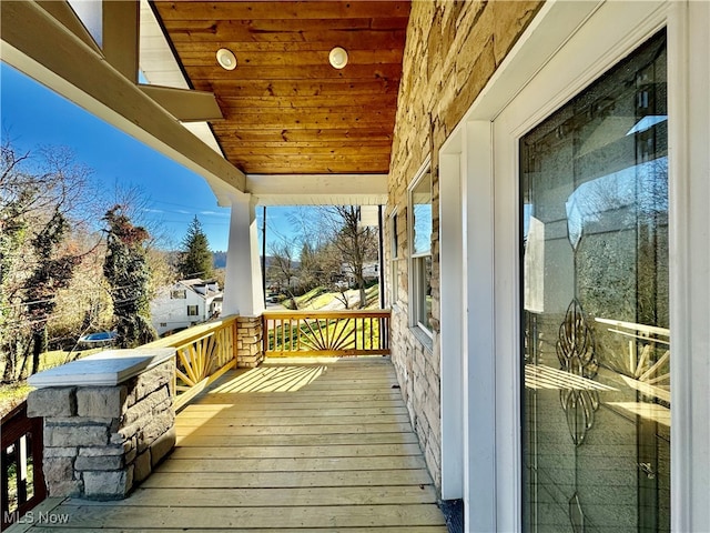 wooden terrace featuring a porch