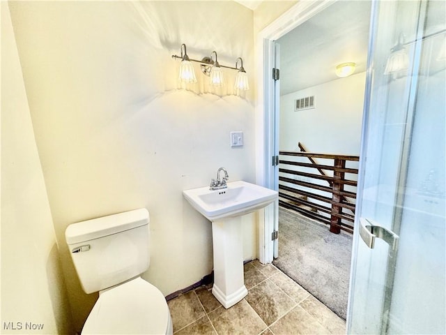 bathroom with tile patterned floors, sink, and toilet