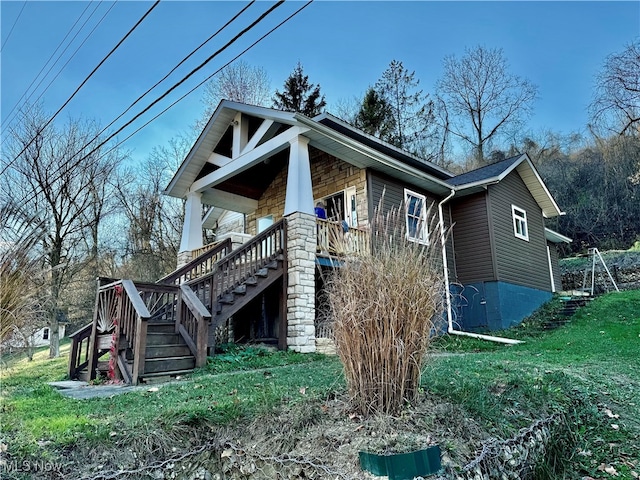 view of property exterior with a porch