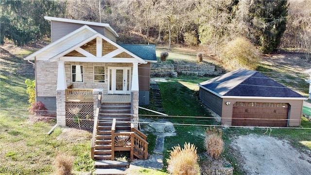 exterior space featuring a porch and a garage