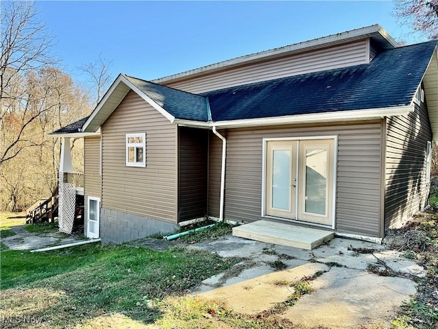 rear view of house featuring french doors