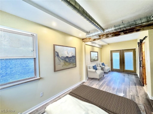 interior space with french doors and hardwood / wood-style flooring