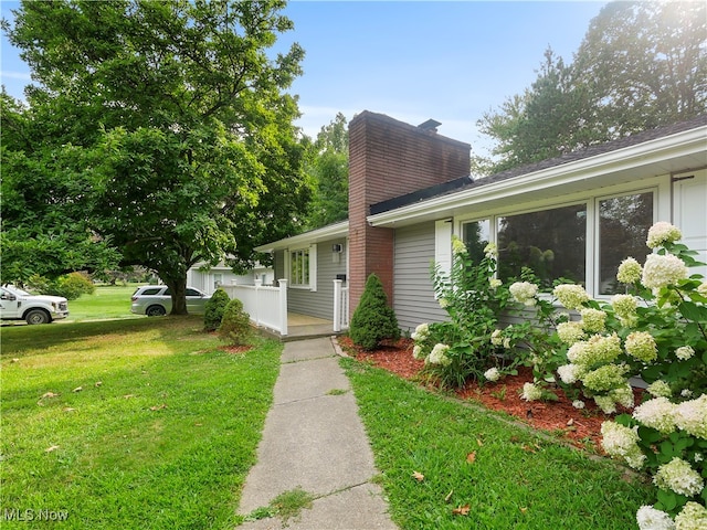 exterior space with a front lawn