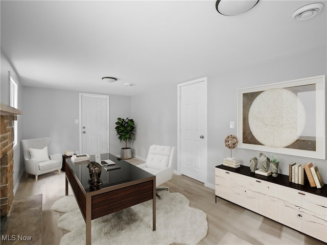 home office with light wood-type flooring