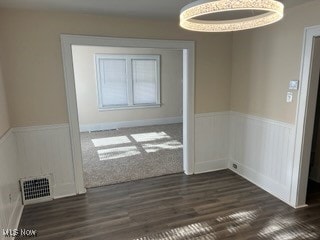 unfurnished room with dark hardwood / wood-style floors