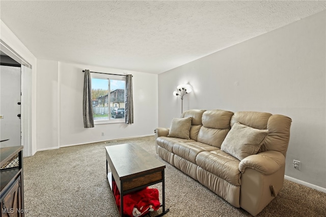 living room with a textured ceiling and carpet floors