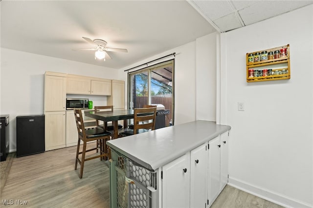 kitchen featuring light hardwood / wood-style floors and ceiling fan