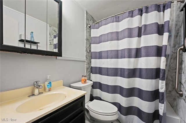 bathroom featuring walk in shower, vanity, and toilet