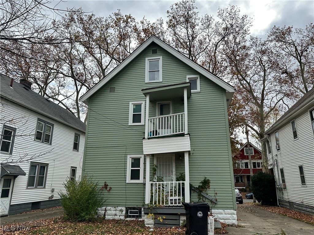 rear view of house with a balcony