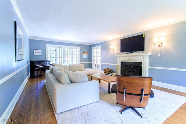 living room with wood-type flooring and crown molding