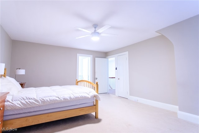 carpeted bedroom featuring ceiling fan