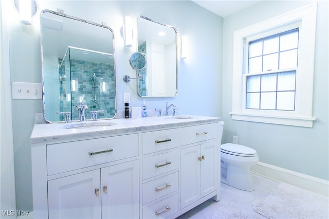 bathroom with walk in shower, vanity, and toilet