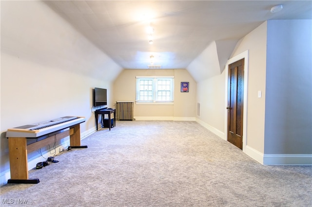 bonus room featuring carpet flooring and lofted ceiling