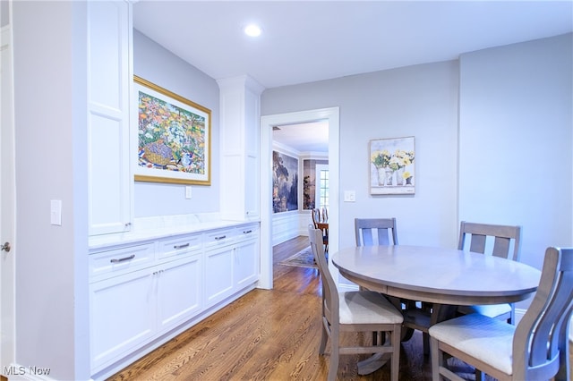 dining room with hardwood / wood-style floors