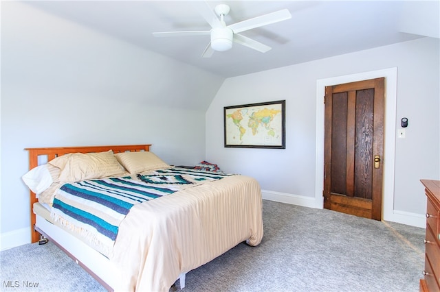 carpeted bedroom featuring lofted ceiling and ceiling fan