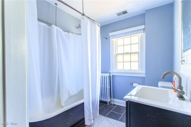 bathroom featuring radiator, tile patterned flooring, vanity, and shower / bath combination with curtain