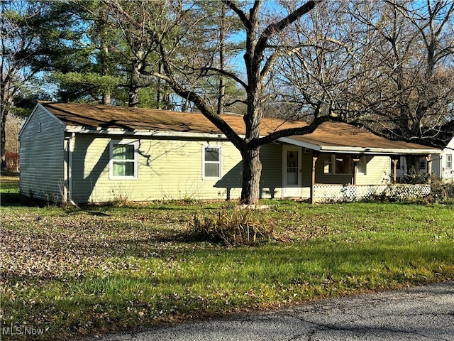 view of property exterior with a lawn